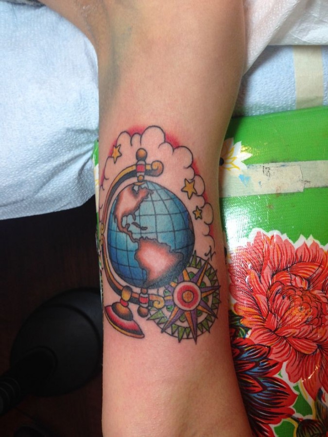 Globe tattoo with compass