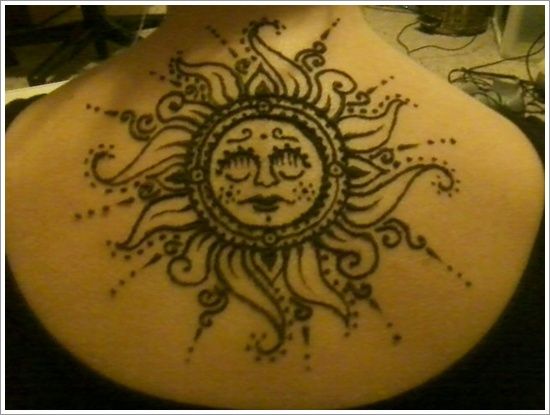 Gorgeous black back sun tattoo