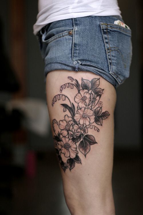 Gorgeous black flower tattoo on leg