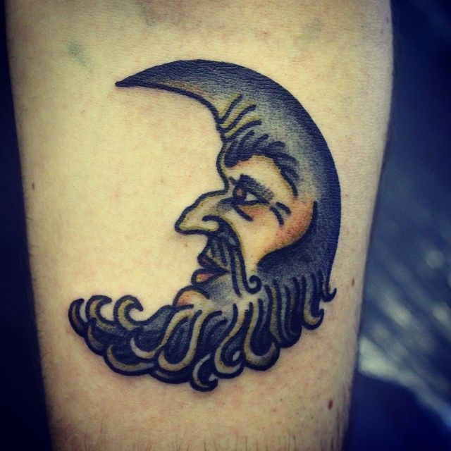 Gorgeous black moon tattoo on arm