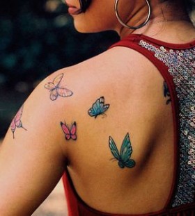 Gorgeous girl butterfly tattoo on arm