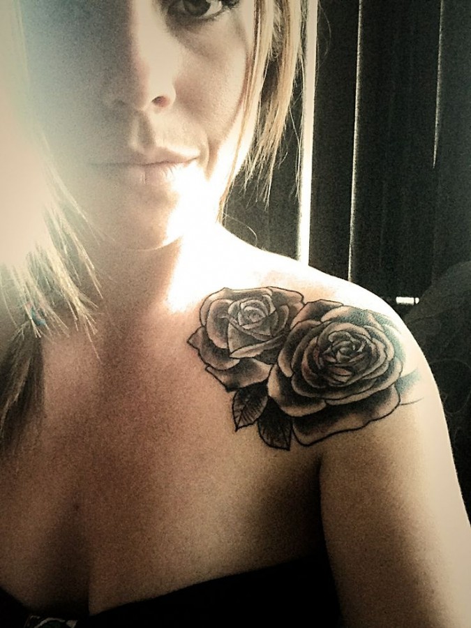 Gorgeous girl rose tattoo on shoulder