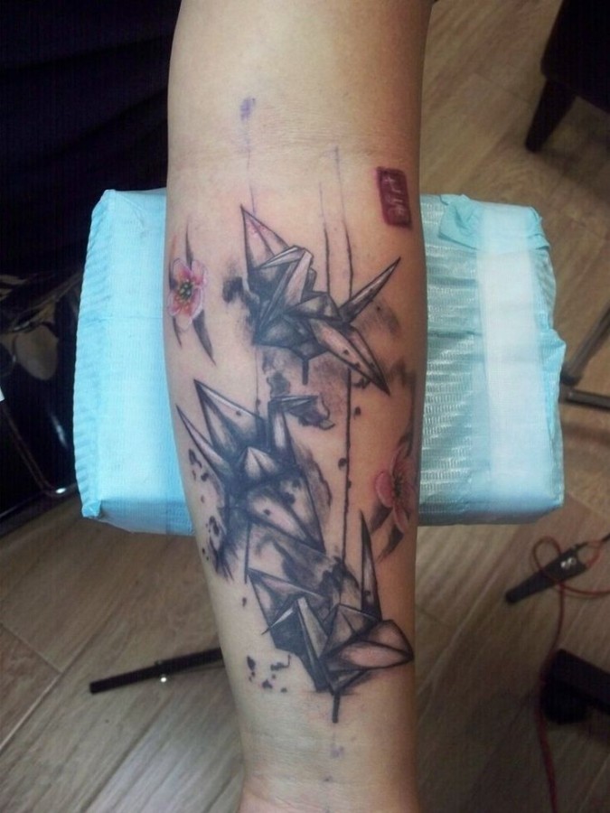 Great black origami tattoo on leg