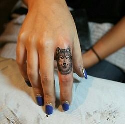 Great wolf tattoo on finger