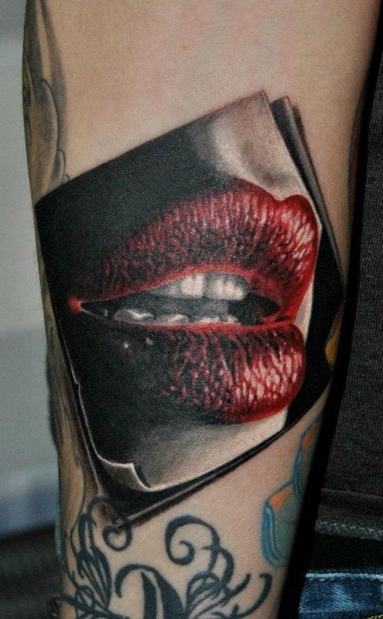 Great women’s lips tattoo on arm