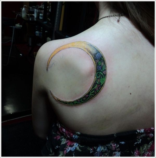 Green and yellow adorable back moon tattoo