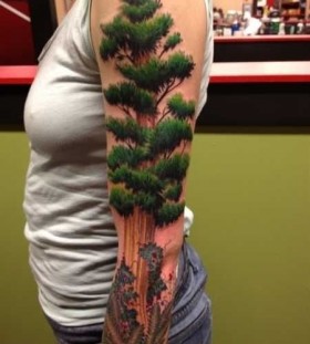 Green lovely tree tattoo on arm