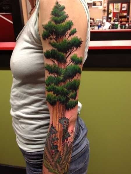 Green lovely tree tattoo on arm