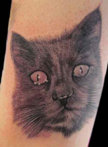 Grey simple cat tattoo on leg