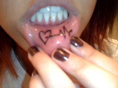 Heart puls lips tattoo