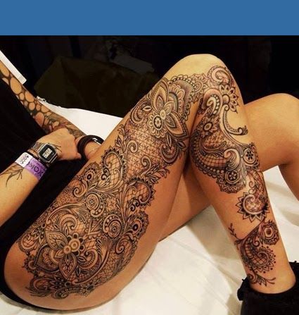 Huge women’s lace tattoo on leg