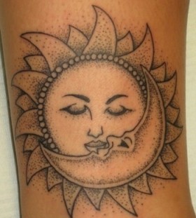 Inner arm moon and sun tattoo on arm