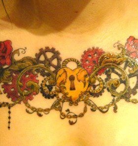Key and flower tattoo on chest