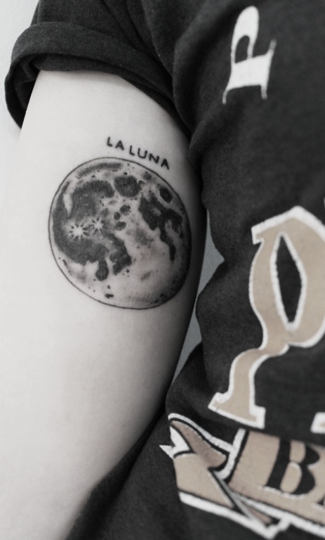 Laluna black moon tattoo on arm