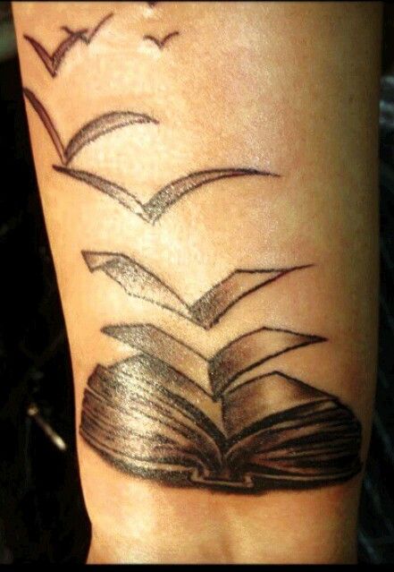 Like birds book tattoo on arm