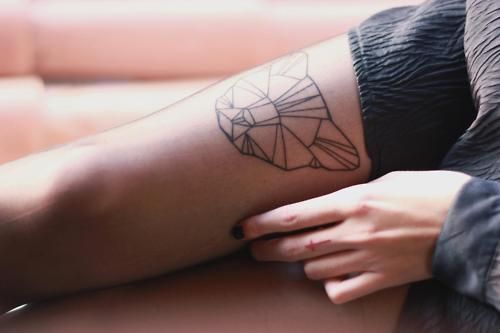 Lovely bear origami tattoo on leg