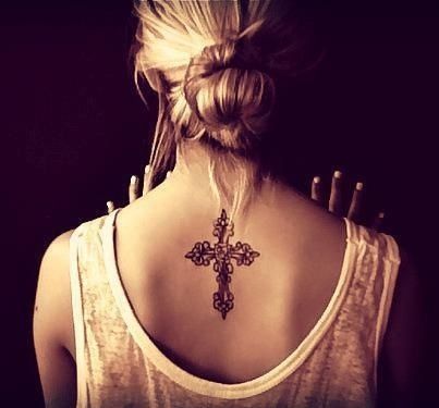 Lovely black back cross tattoo