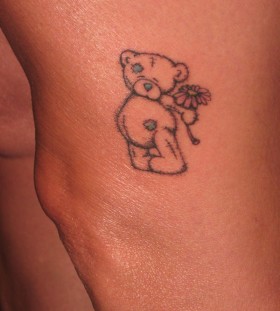 Lovely black bear tattoo on leg and pink flower