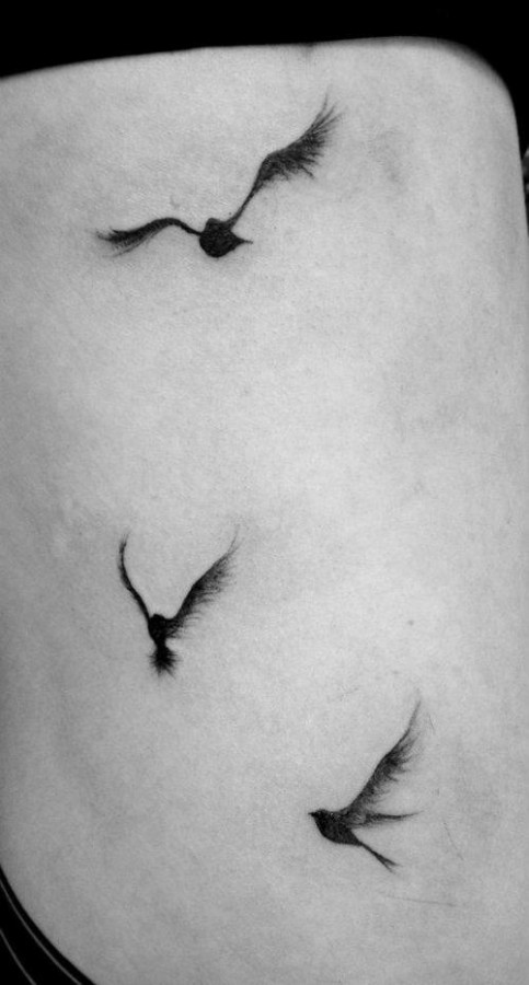 Lovely black bird tattoo