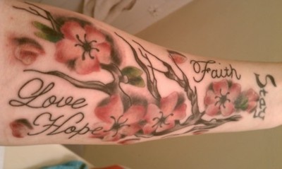 Lovely black cherry tattoo on arm