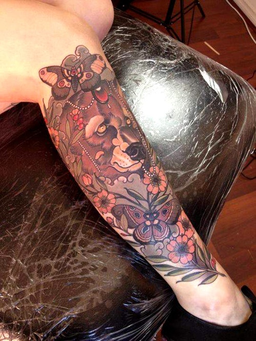 Lovely flowers and bear tattoo on leg