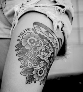 Lovely flowers and skull tattoo on leg