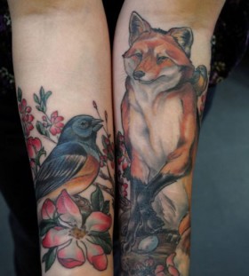 Lovely fox and bird tattoo on arm
