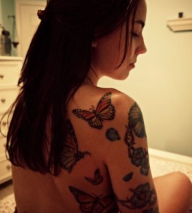 Lovely girl butterfly tattoo on arm