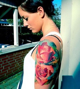 Lovely girl red rose tattoo on arm