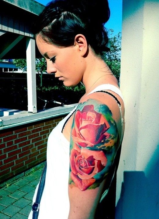 Lovely girl red rose tattoo on arm