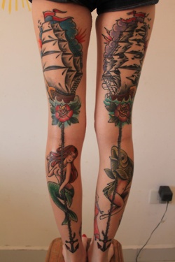 Lovely girl’s fish tattoo on leg