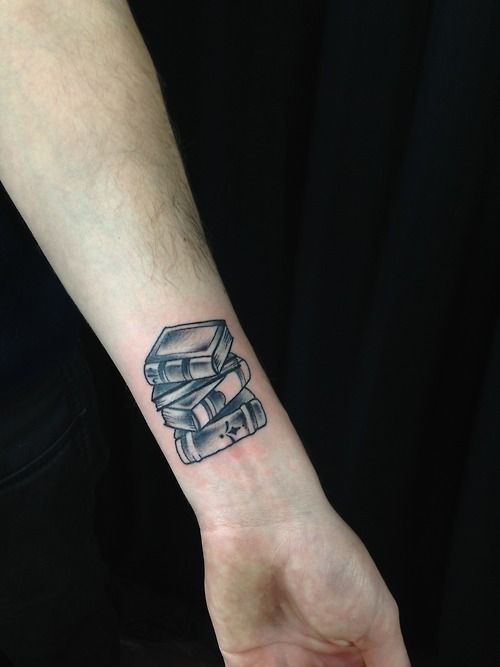 Lovley black book tattoo on arm