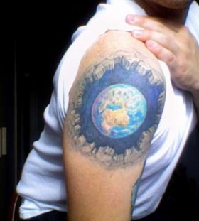 Man with globe tattoo on arm
