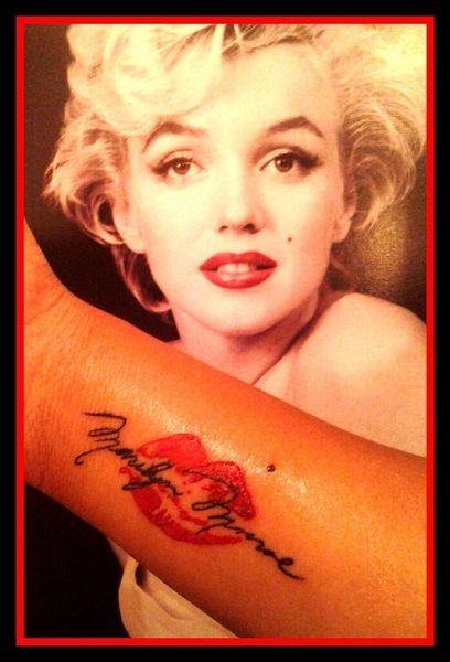 Marilyn Monroe and lips tattoo on arm