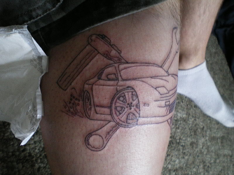 Modern style car tattoo on leg