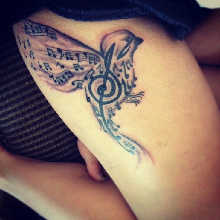 Music style bird tattoo on leg