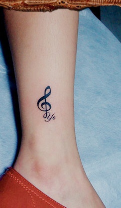 Music style quote tattoo on leg