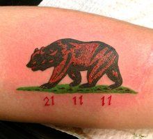 Numbers and California bear tattoo on arm