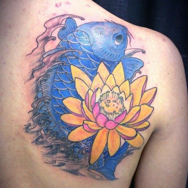 Orange flower and blue fish tattoo on arm