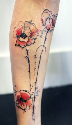 Pattern watercolor poppy tattoo on leg