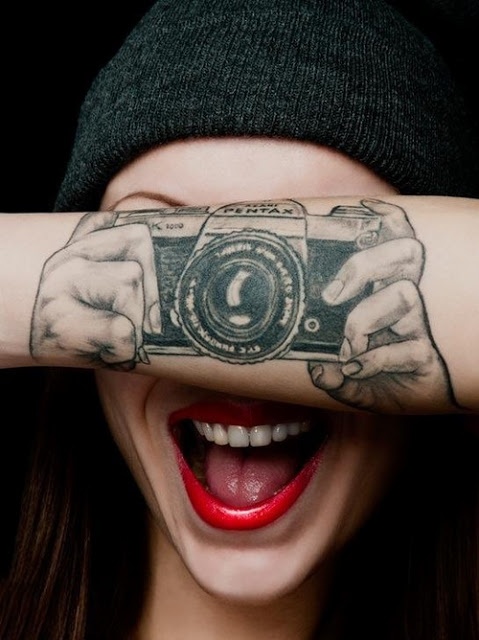 Pentax lovely camera tattoo on arm