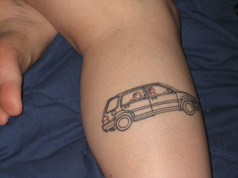 Peoples inside black funny car tattoo on leg