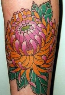 Pink flower tattoo on leg