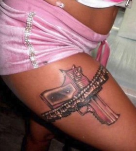 Pink lovely gun tattoo