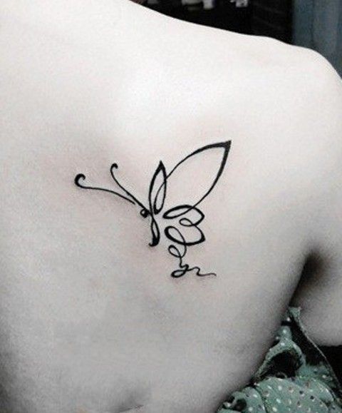 Pretty black butterfly tattoo on shoulder