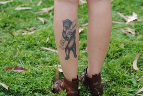 Pretty black california bear tattoo on leg