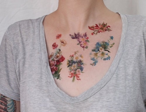 Pretty simple flower tattoo on chest