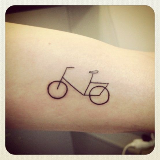 Pretty small bicycle tattoo on arm