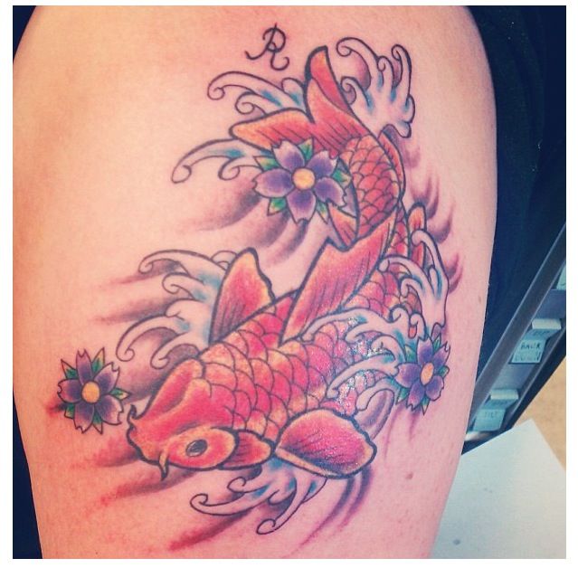 Purpel flower and red fish tattoo on leg