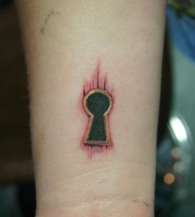 Red and black keyhole tattoo